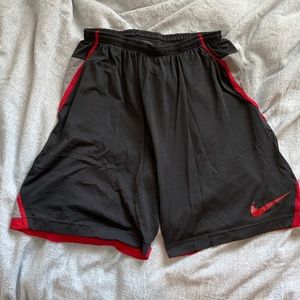 Black, red, and grey Nike hoop shorts